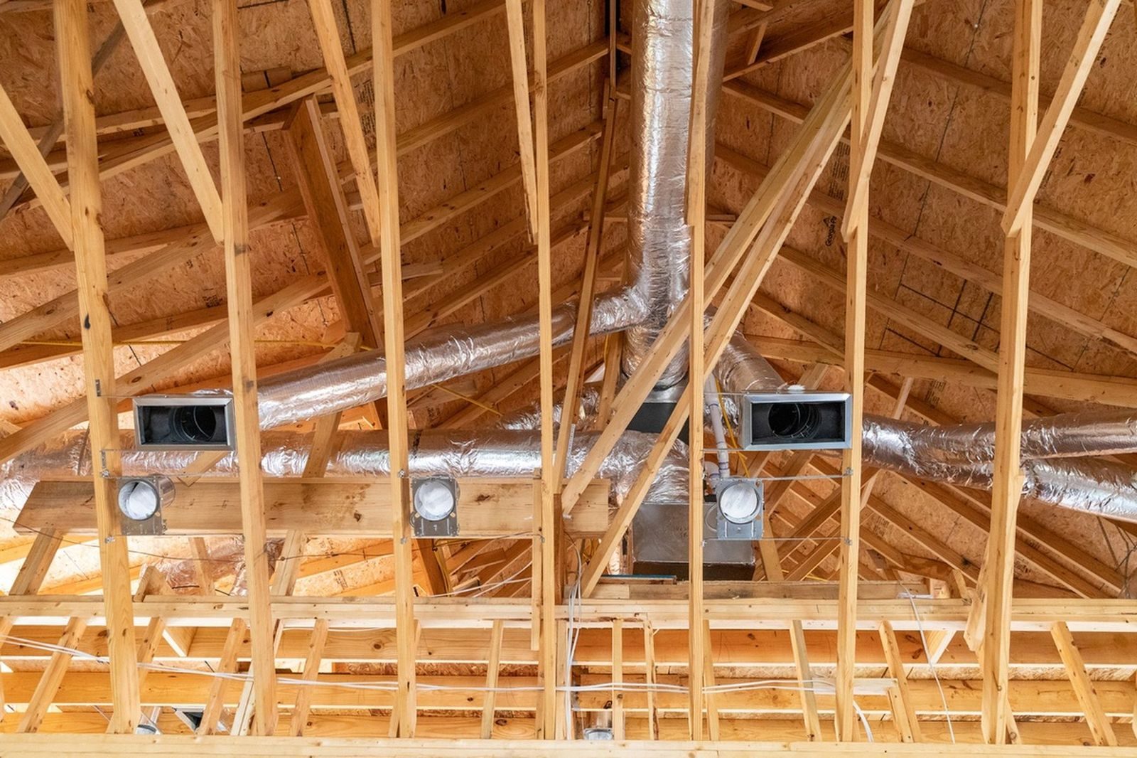 HVAC ductwork installation in a home under construction